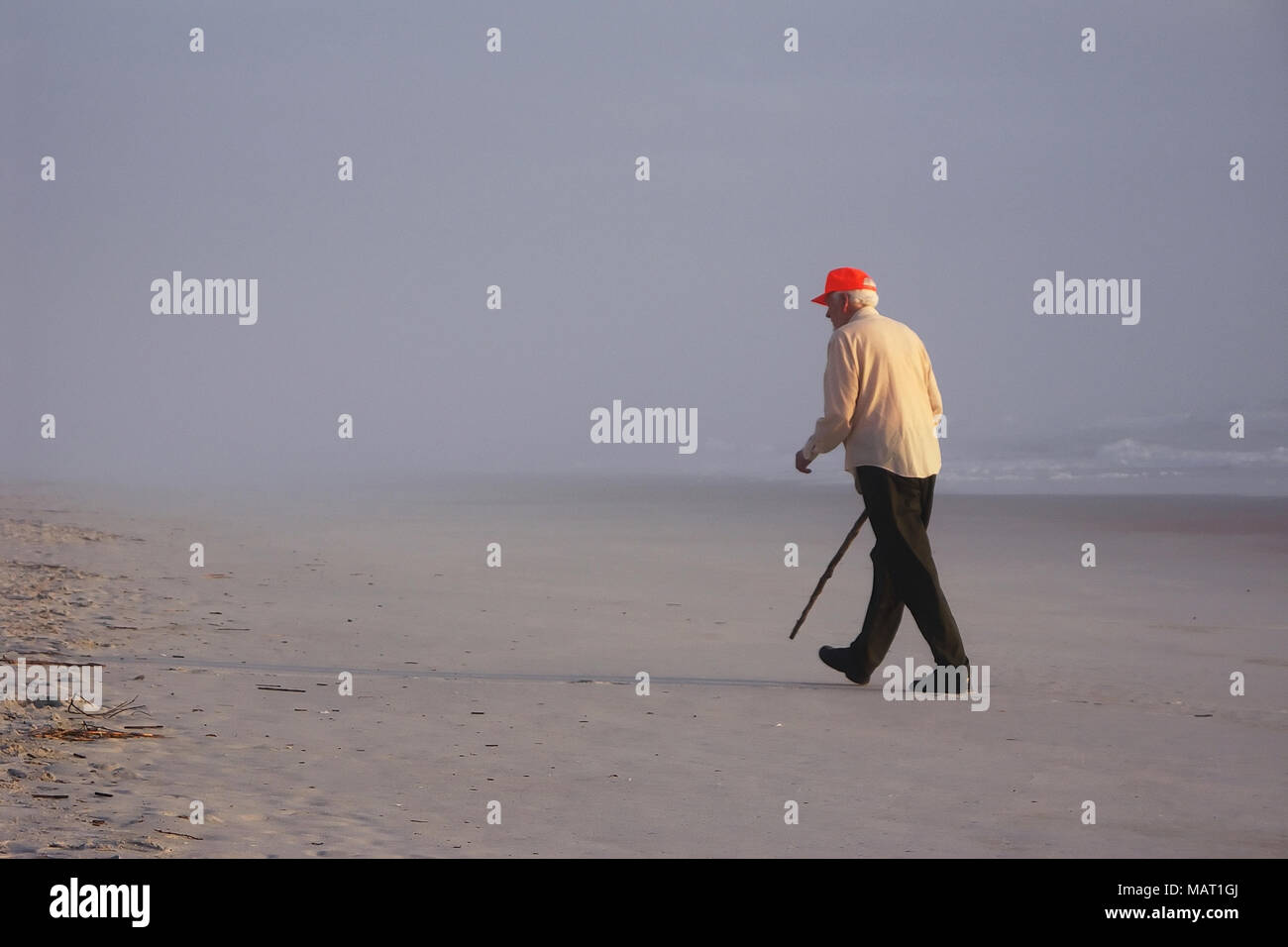 Old man walking on beach hi-res stock photography and images - Alamy