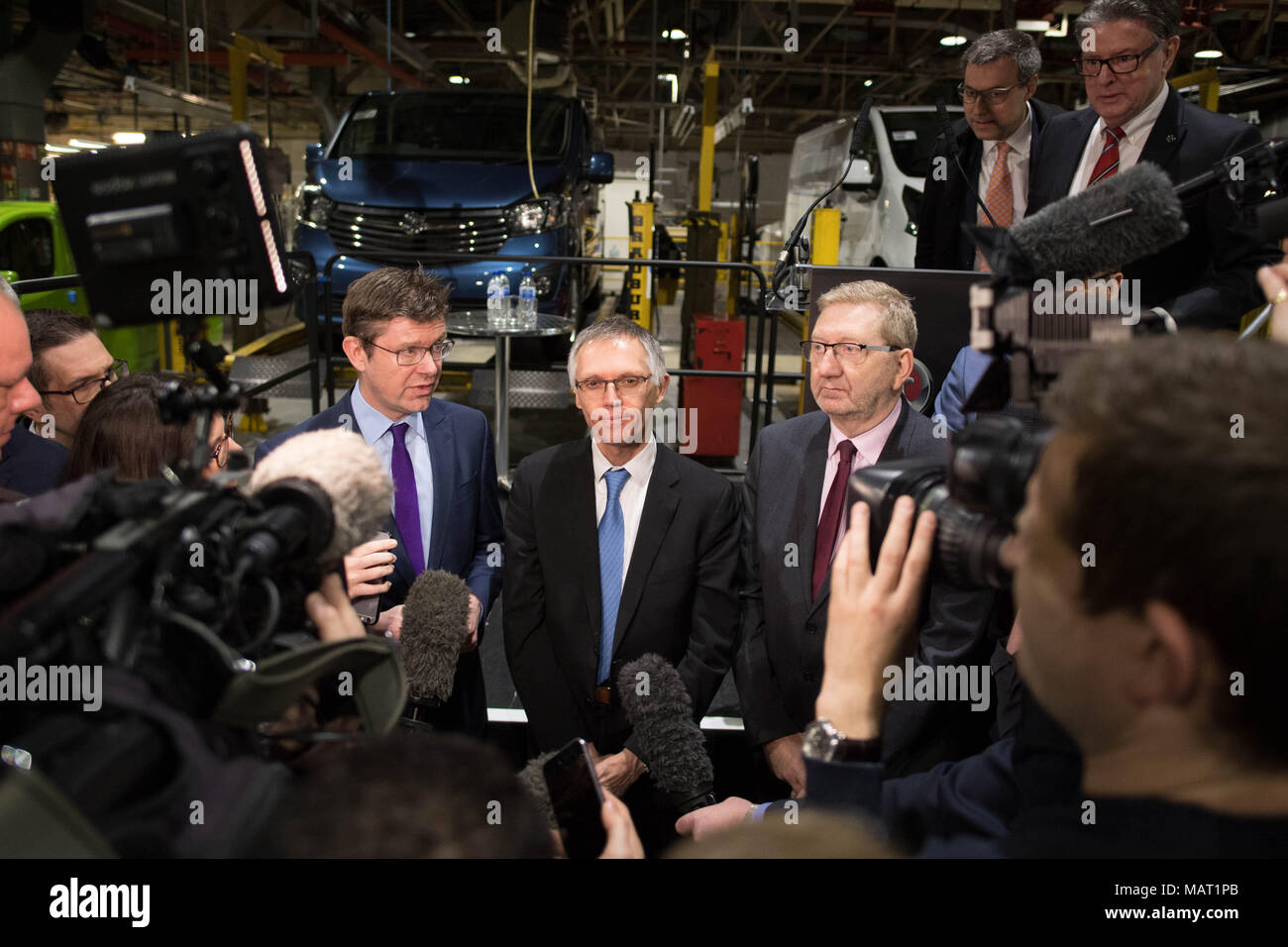 (left to right) Business Secretary Greg Clarke, Chairman of Groupe PSA Carlos Tavares and Unite's general secretary Len McCluskey speak to the media during a visit to the Vauxhall plant in Luton to announce its plans to build a new van. Stock Photo