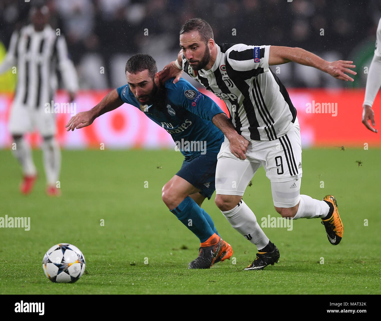 Turin, Italy. 3rd Apr, 2018. Real Madrid's Dani Carvajal (L) vies with Juventus' Gonzalo Higuain during the UEFA Champions League quarterfinal first leg soccer match between Juventus and Real Madrid in Turin, Italy, on April 3, 2018. Real Madrid won 3-0. Credit: Alberto Lingria/Xinhua/Alamy Live News Stock Photo