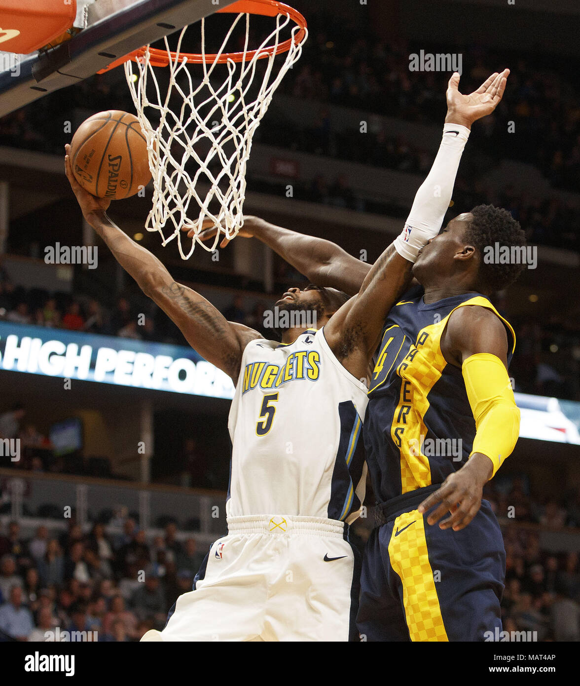 Denver, Colorado, USA. 3rd Apr, 2018. Nuggets WILL BARTON, left, gets fouled by Pacers VICTOR OLADIPO, right, during the 1st. Half at the Pepsi Center Tuesday Night. The Nuggets beat the Pacers 107-104. Credit: Hector Acevedo/ZUMA Wire/Alamy Live News Stock Photo