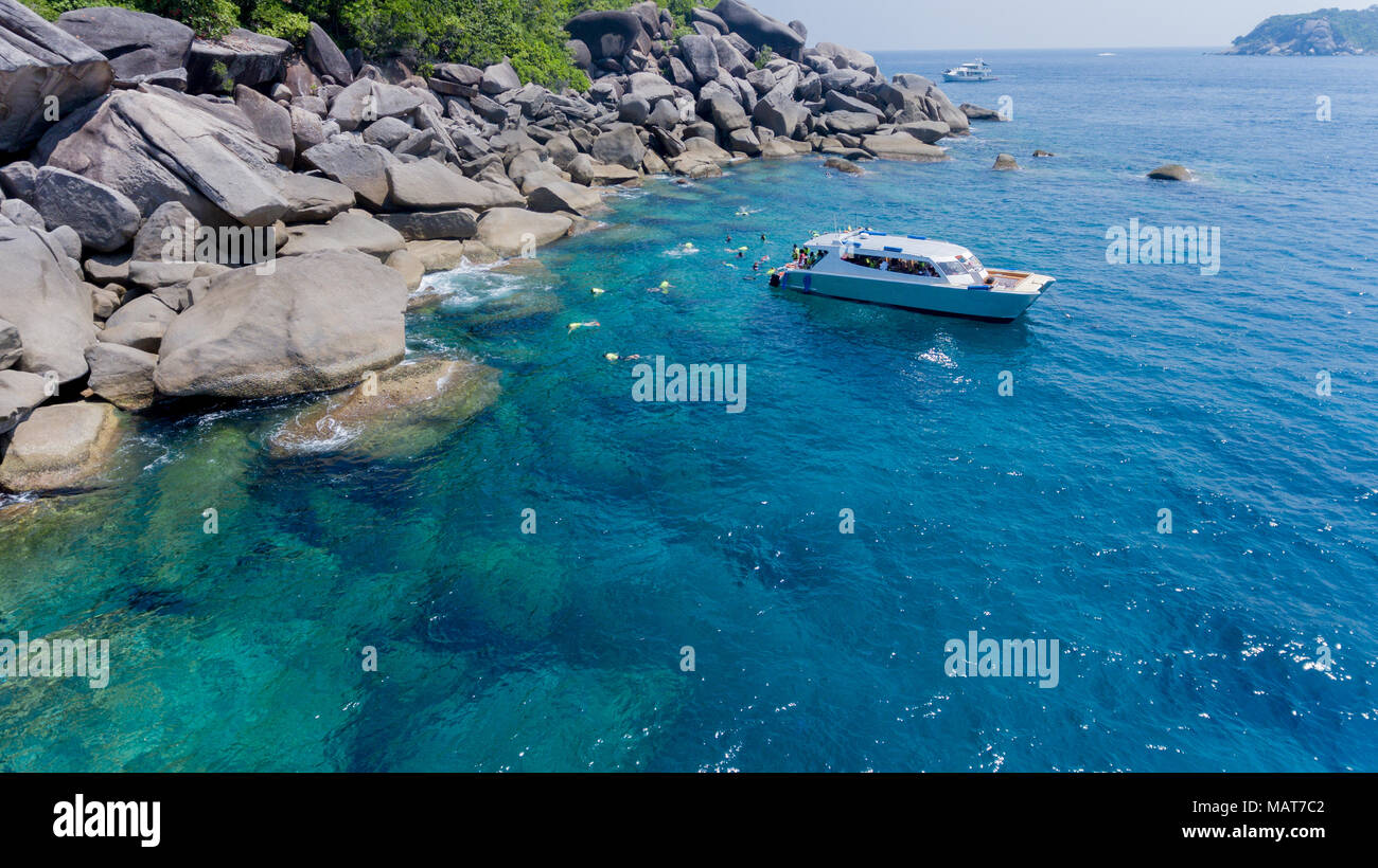 Aerial photo of people snorkeling in tropical Coral reef in Similan island Thailand Stock Photo