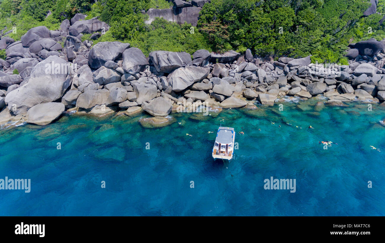 Aerial photo of people snorkeling in tropical Coral reef in Similan island Thailand Stock Photo