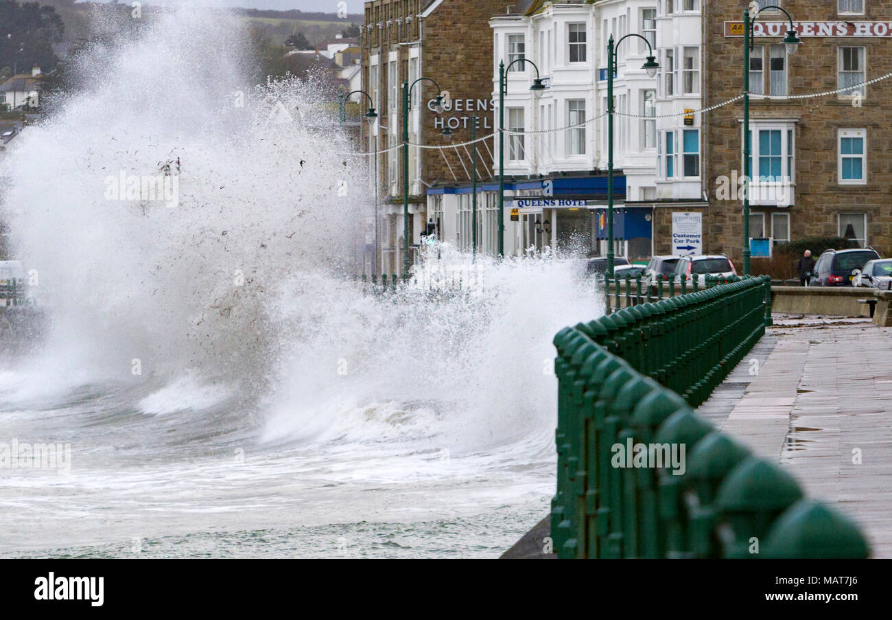 Penzance, Cornwall, UK. 4th April 2018.  A fast moving late winter storm brings waves as high as three storey hotels to the south west coast as Britain struggles to move properly in to Spring. Credit Mike Newman/Alamy Live News Stock Photo