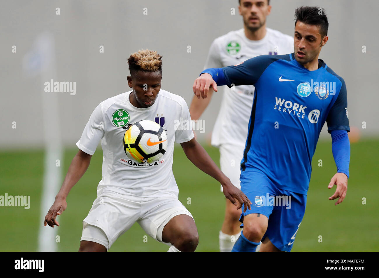 Budapest, Hungary. 4th Apr, 2018. (l-r) Alassane Diallo of Ujpest FC wins  the ball from Laszlo Lencse of MTK Budapest during the Hungarian Cup  Quarter Final 2nd Leg match between MTK Budapest