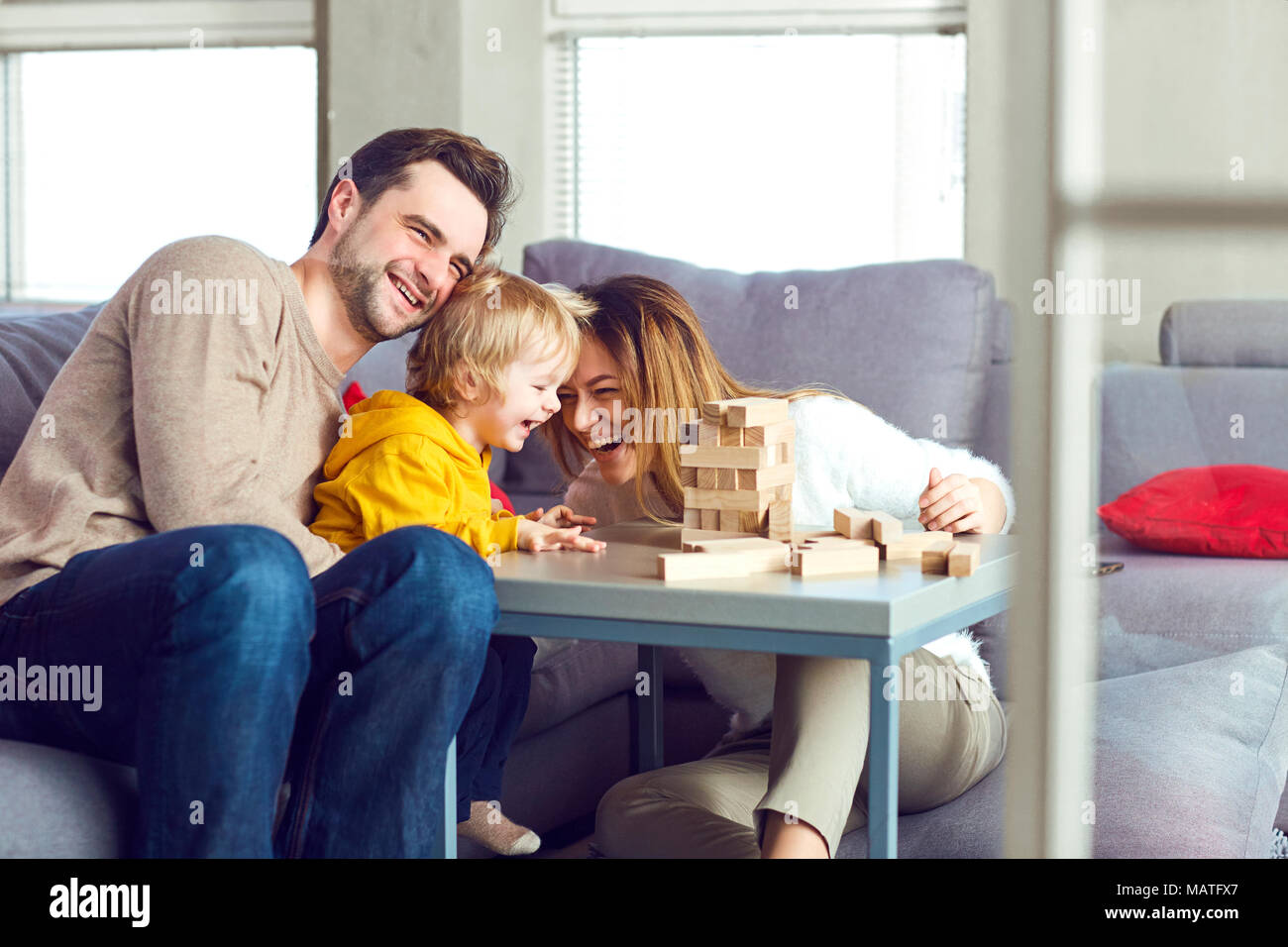 Happy family playing board games on the table. Stock Photo