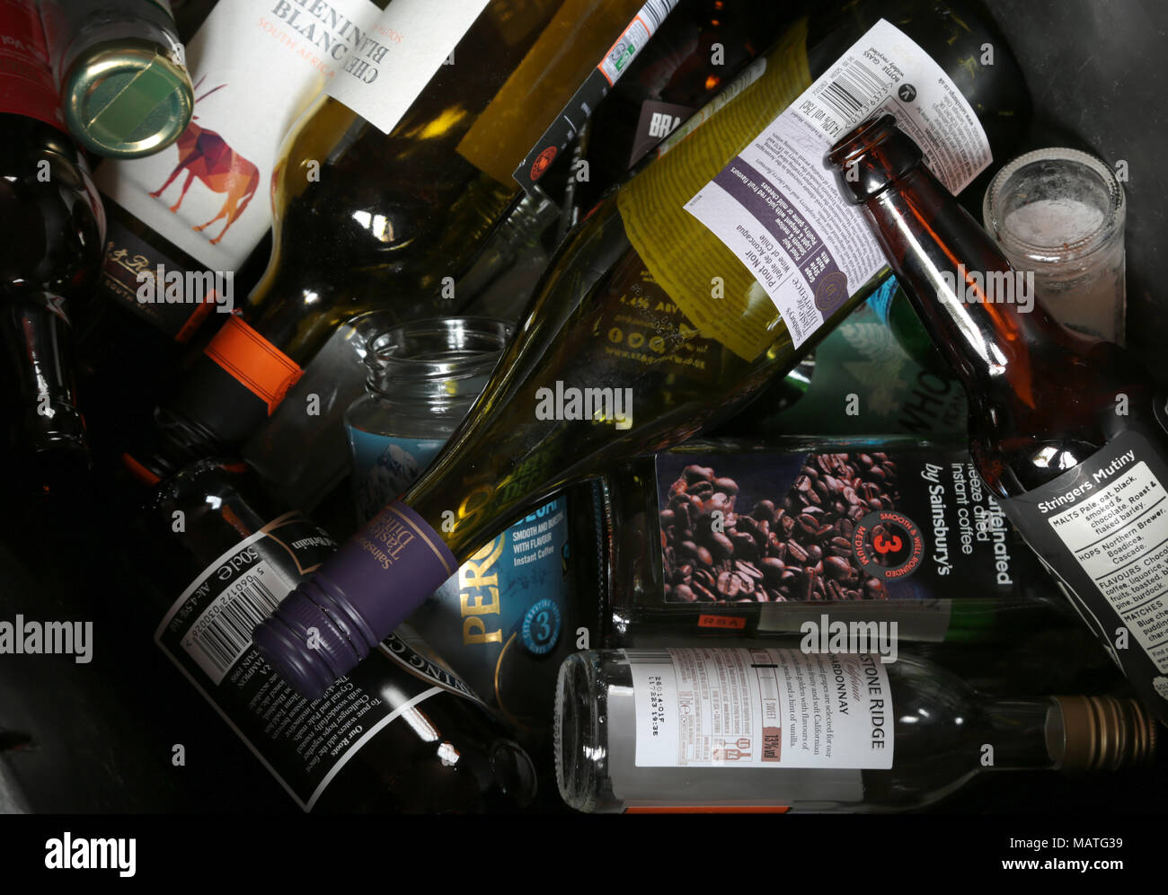 Household glass bottles and jars waiting for collection to be recycled