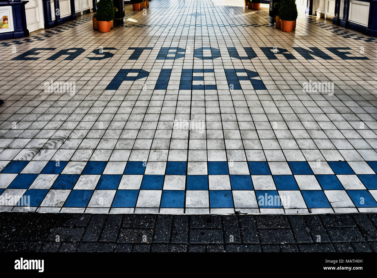 Tiled flooring at the entrance to Eastbourne pier, East Sussex, England, UK Stock Photo