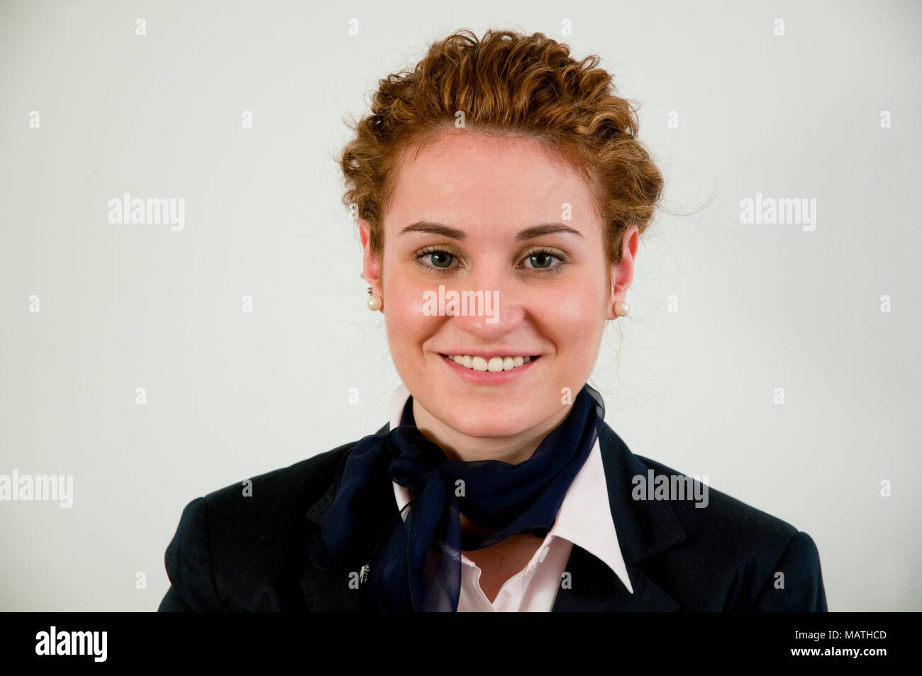 Portrait of young executive woman smiling and looking at the camera. Stock Photo