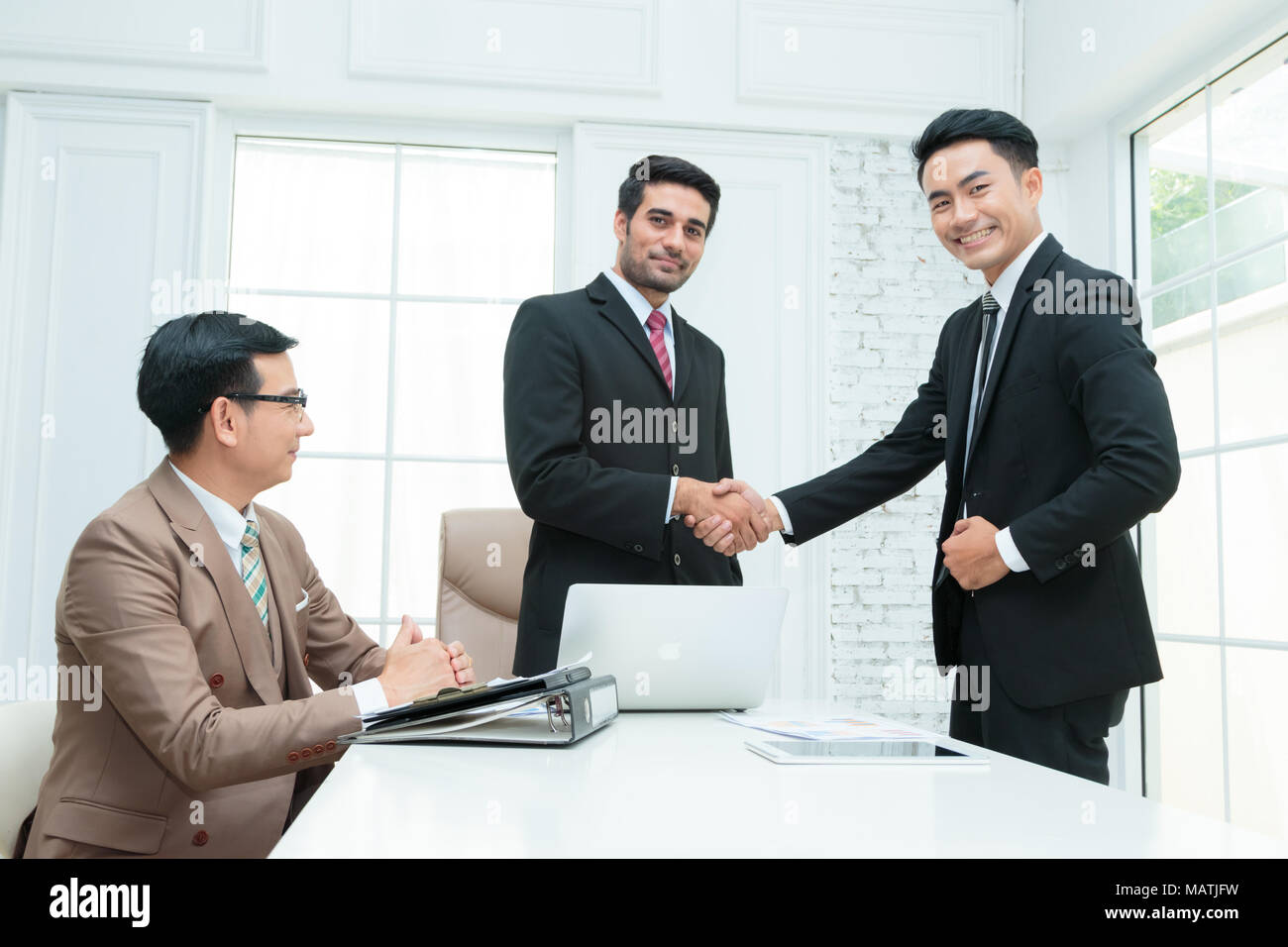 Successfully Dealt Business people shaking hands and closing successful deal Stock Photo ...