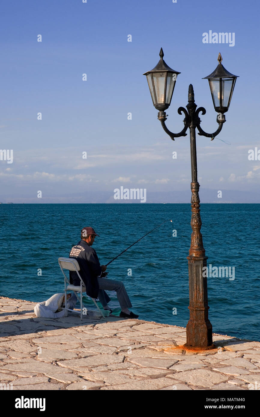 A fisherman on the quayside, Vonitsa, Ambracian Gulf, Greece Stock Photo