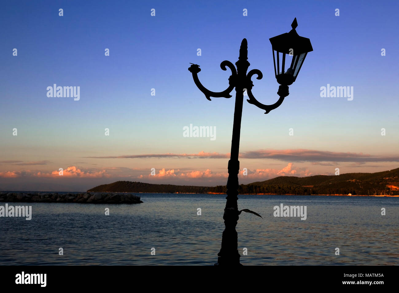 A battered and drunken lamppost, Vonitsa, Amvrakkios Gulf, Greece Stock Photo