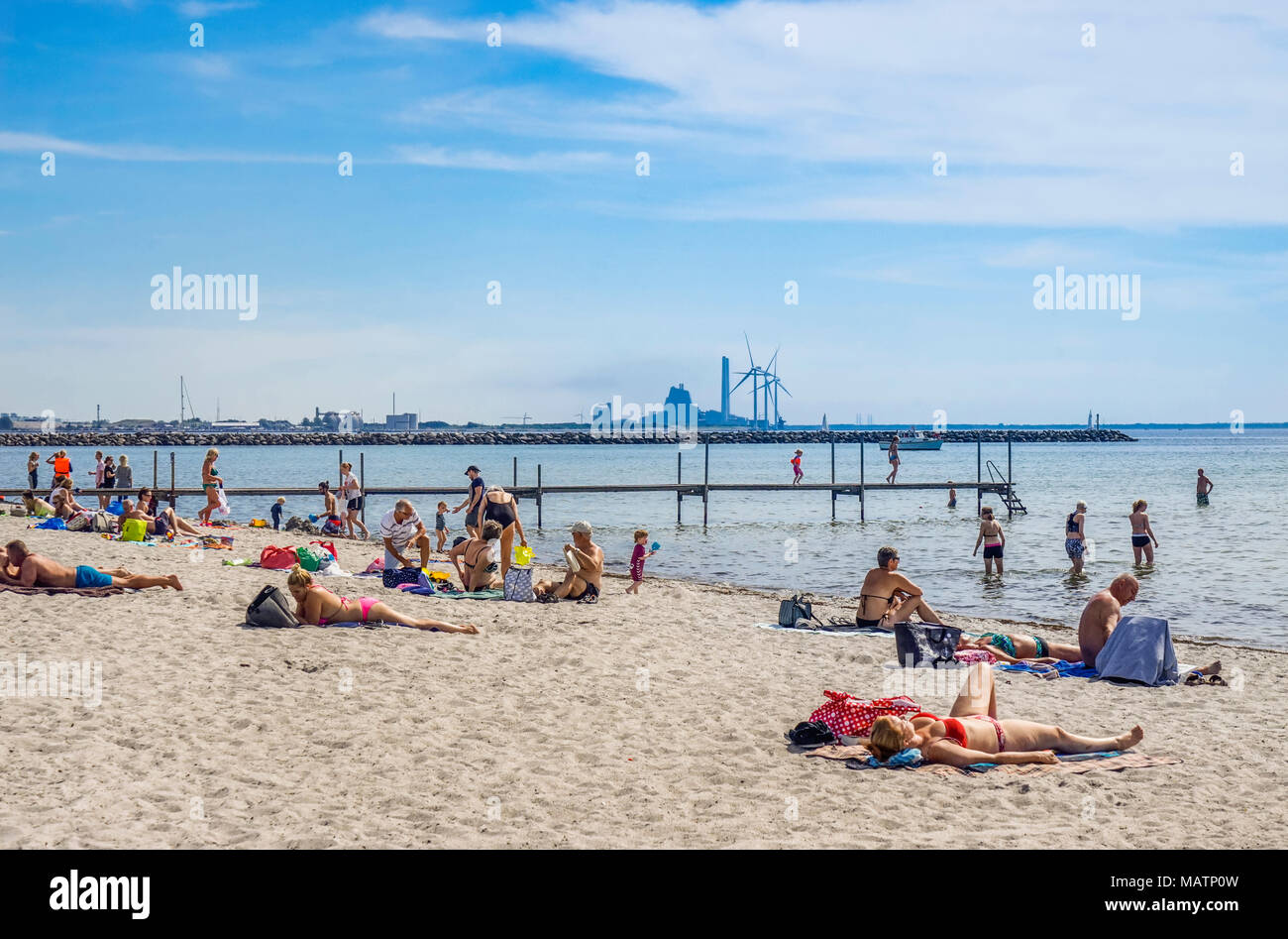 Baltic Sea beach at Ishøj on the Køge Bay, a southwester suburban area of Copenhagen with the high-technology facility Avedøre Power Station in the ba Stock Photo