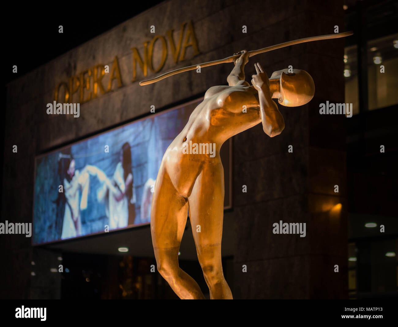Sculpture 'New Archer' in front of the opera 'Opera Nova' at night in Bydgoszcz, Poland Stock Photo