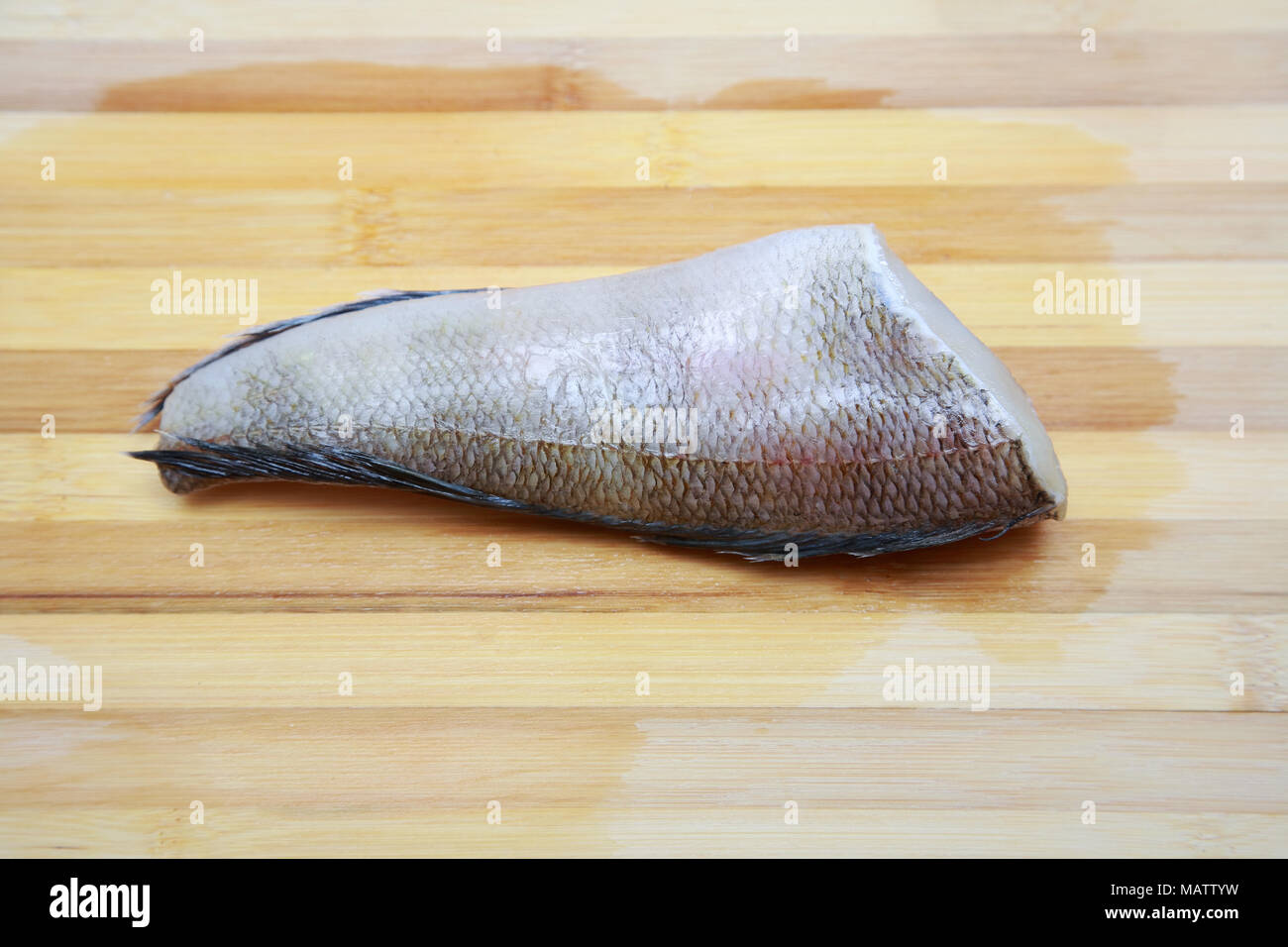 Fish notothenia on a cutting board close-up Stock Photo