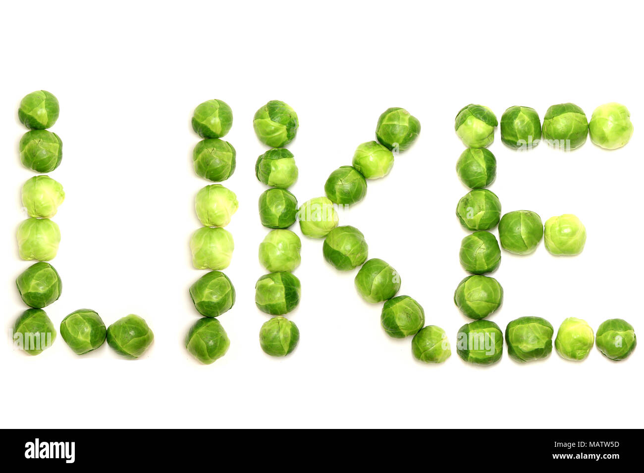 Brussel sprouts spelling the word like on a plain white background Stock Photo