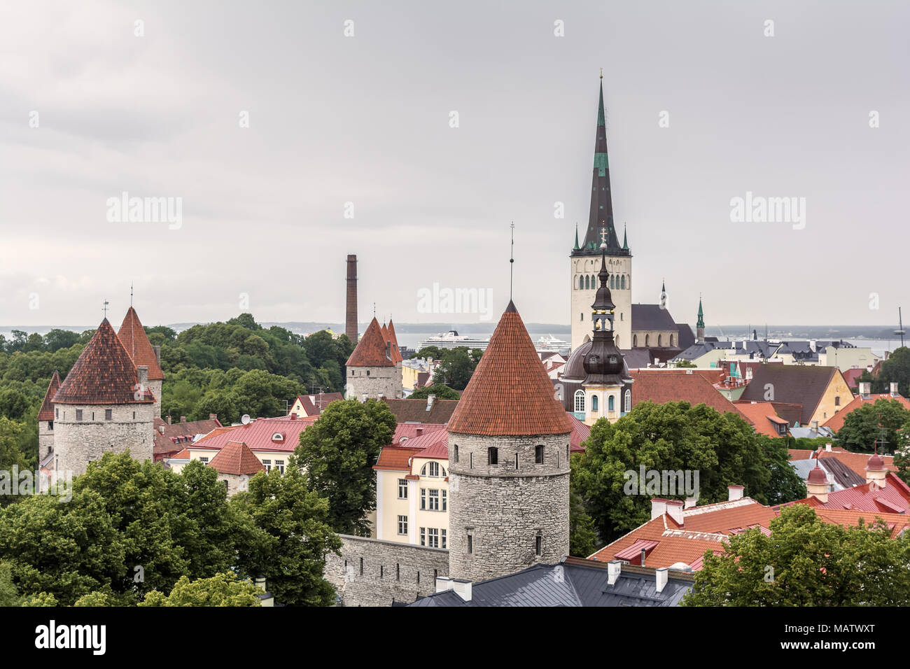 City landscape with red tiled roofs of old city and steeples on summer day in Tallinn, Estonia Stock Photo