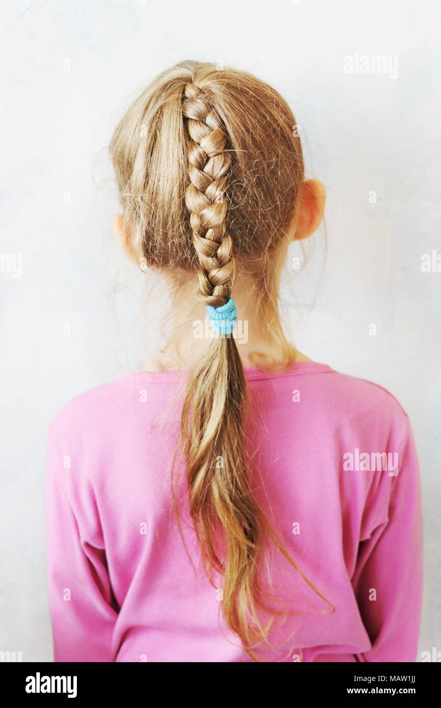 A Little White Girl With A Long Light Plait Stock Photo