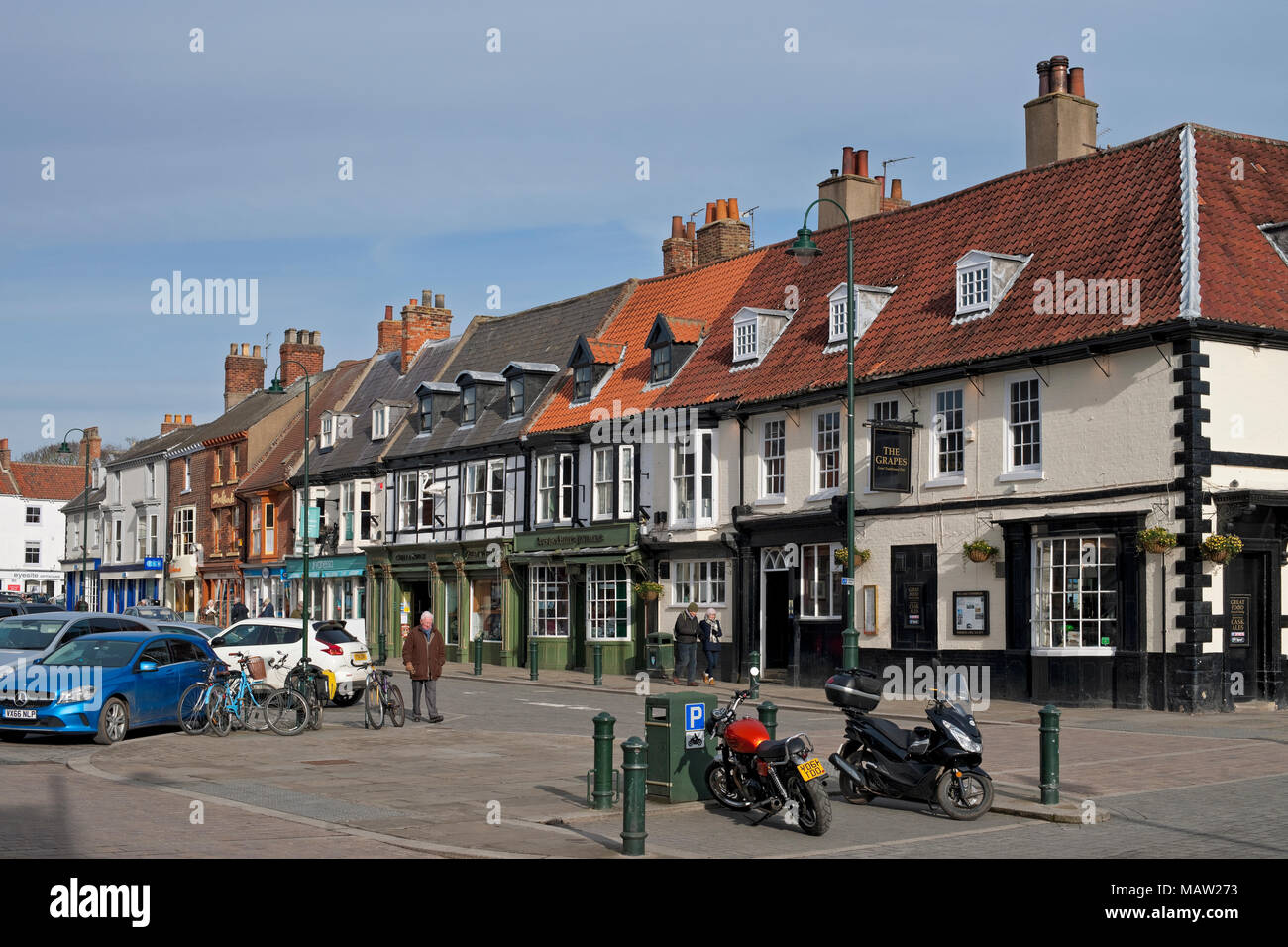 Row of shops store in the town centre in spring Market Square Beverley East Yorkshire England UK United Kingdom GB Great Britain Stock Photo