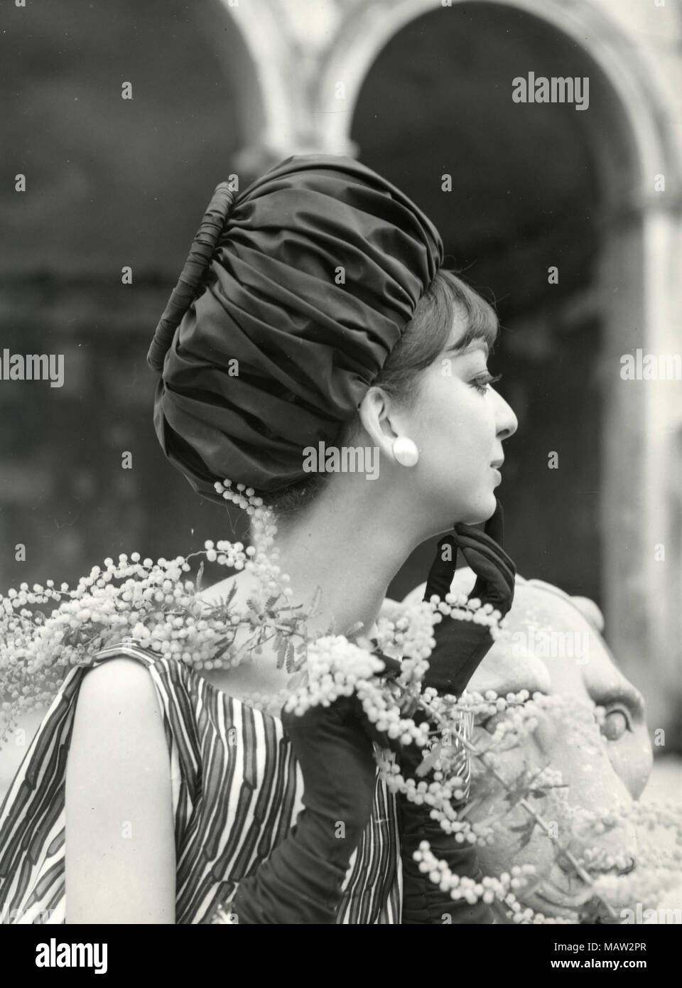 Model from the sixties wearing hat and zebra dress, Italy Stock Photo