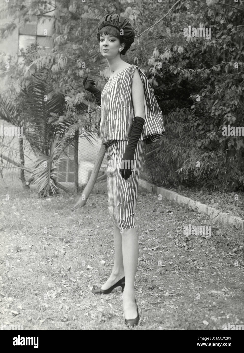 Model from the sixties wearing hat and zebra dress, Italy Stock Photo