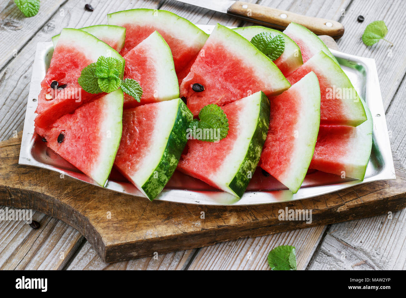 Fresh Sliced Watermelon In A Metal Bowl Wooden Background Stock Photo fresh-sliced-watermelon-in-a-metal-bowl-wooden-background-stock-photo