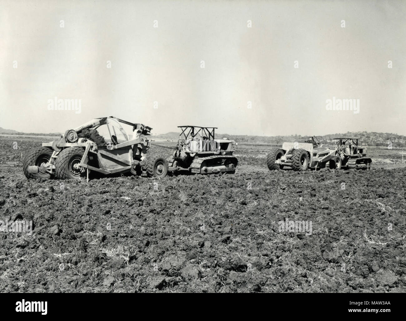 Soil conservation machines levelling on surface irrigation farm,  Rhodesian Selection Trust, Kafue Pilot Polder, Zambia, South Rhodesia 1957 Stock Photo