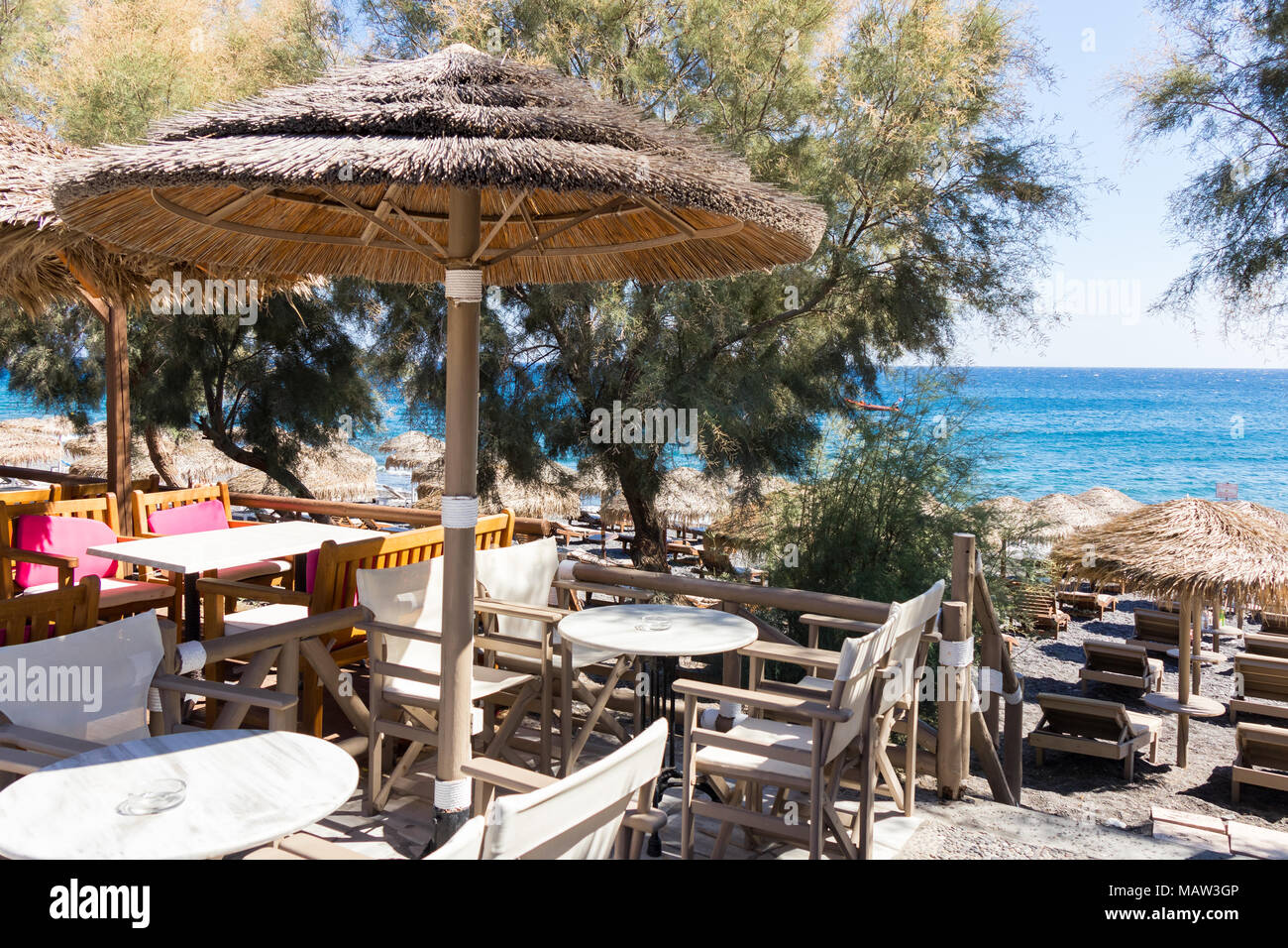 restaurant terrace in front of the beach in kamari on the island of santorini Stock Photo