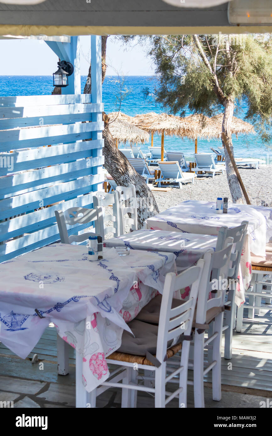 restaurant terrace in front of the beach in kamari on the island of santorini Stock Photo Alamy