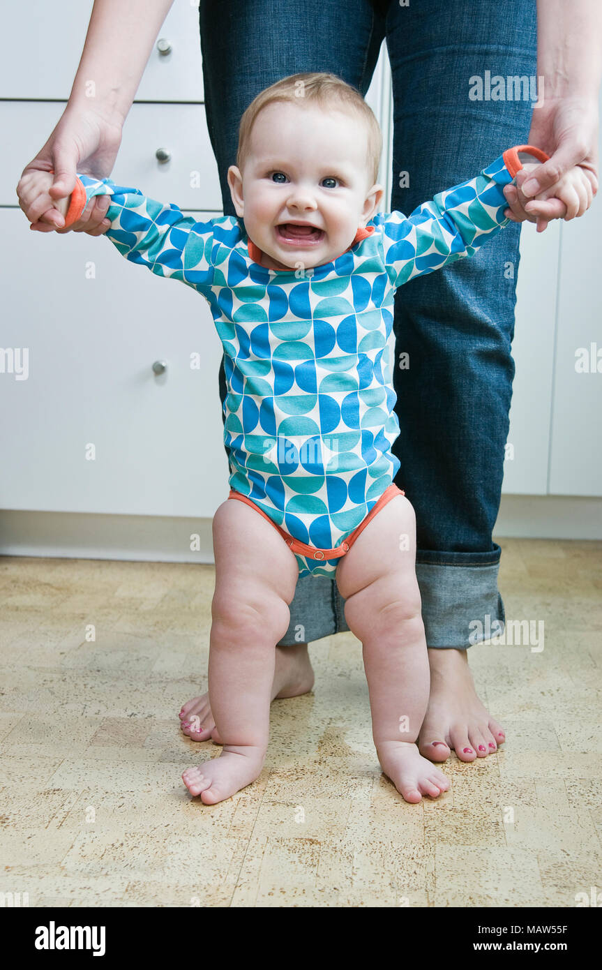 helping baby stand