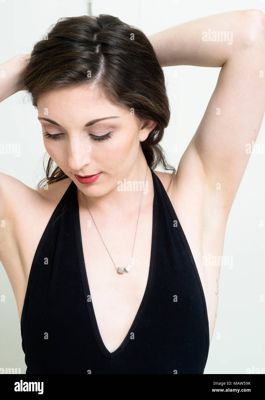 A portrait of a woman wearing a necklace. Stock Photo