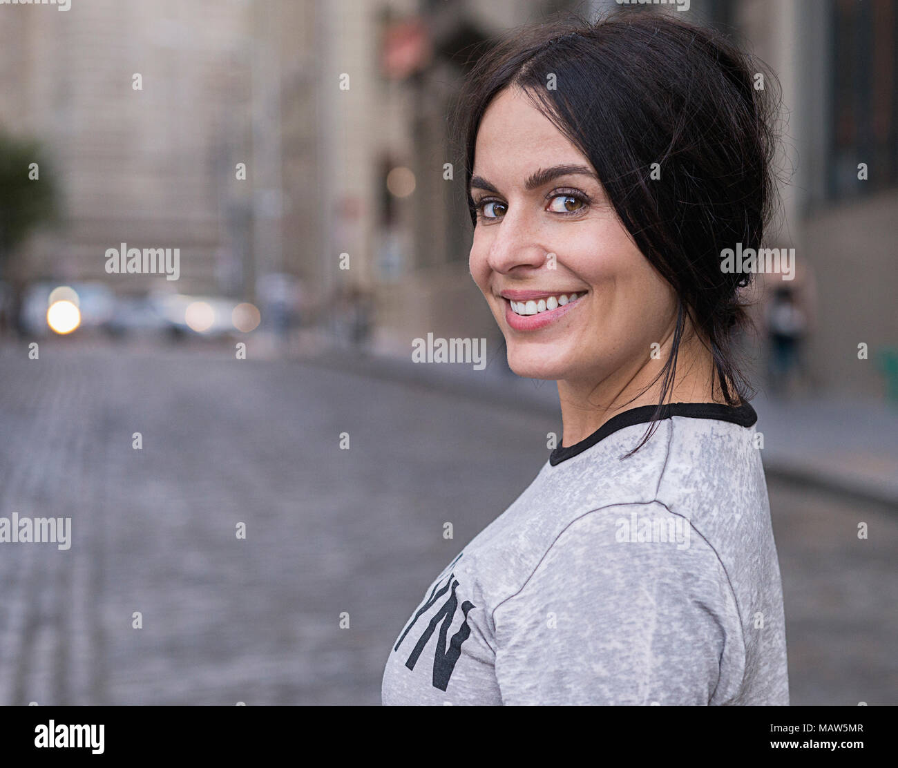 Woman standing on the street hi-res stock photography and images - Alamy