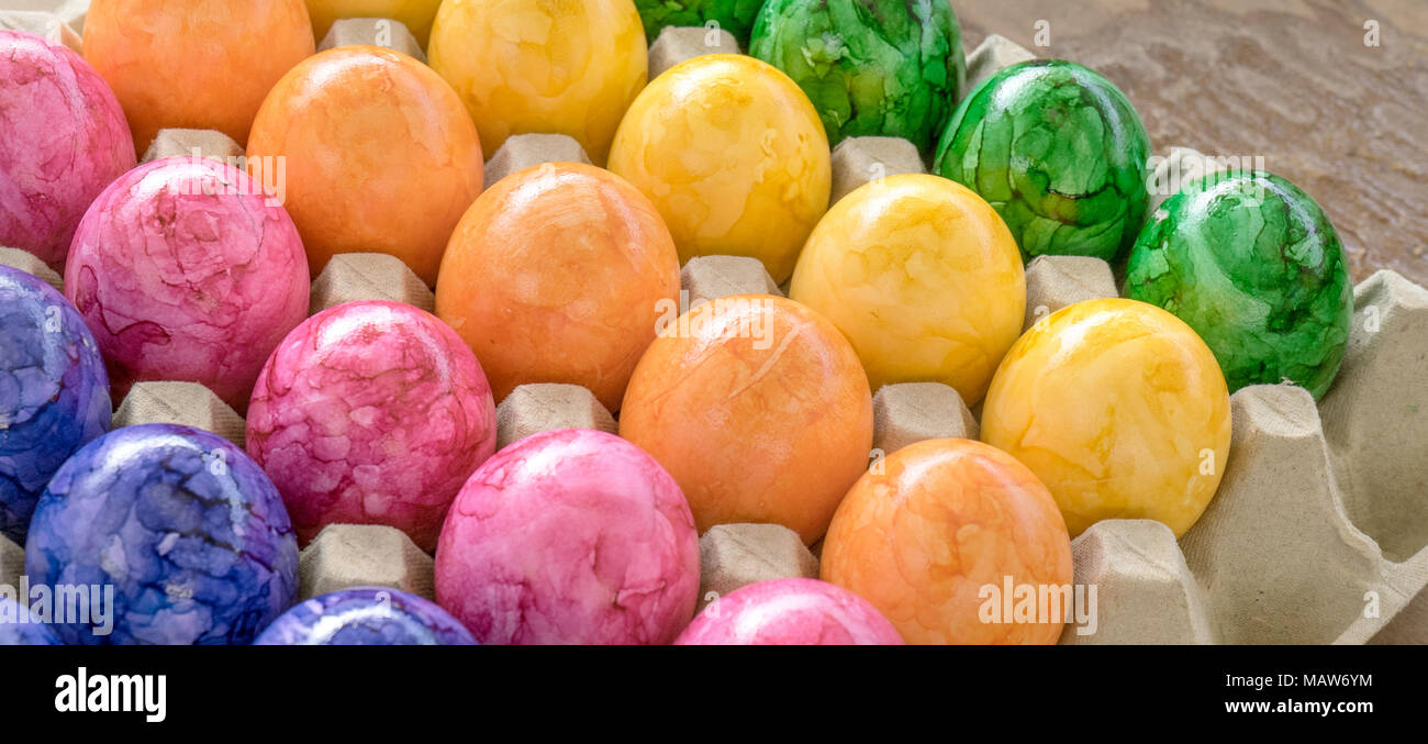 Cardboard box with colored easter eggs Stock Photo Alamy