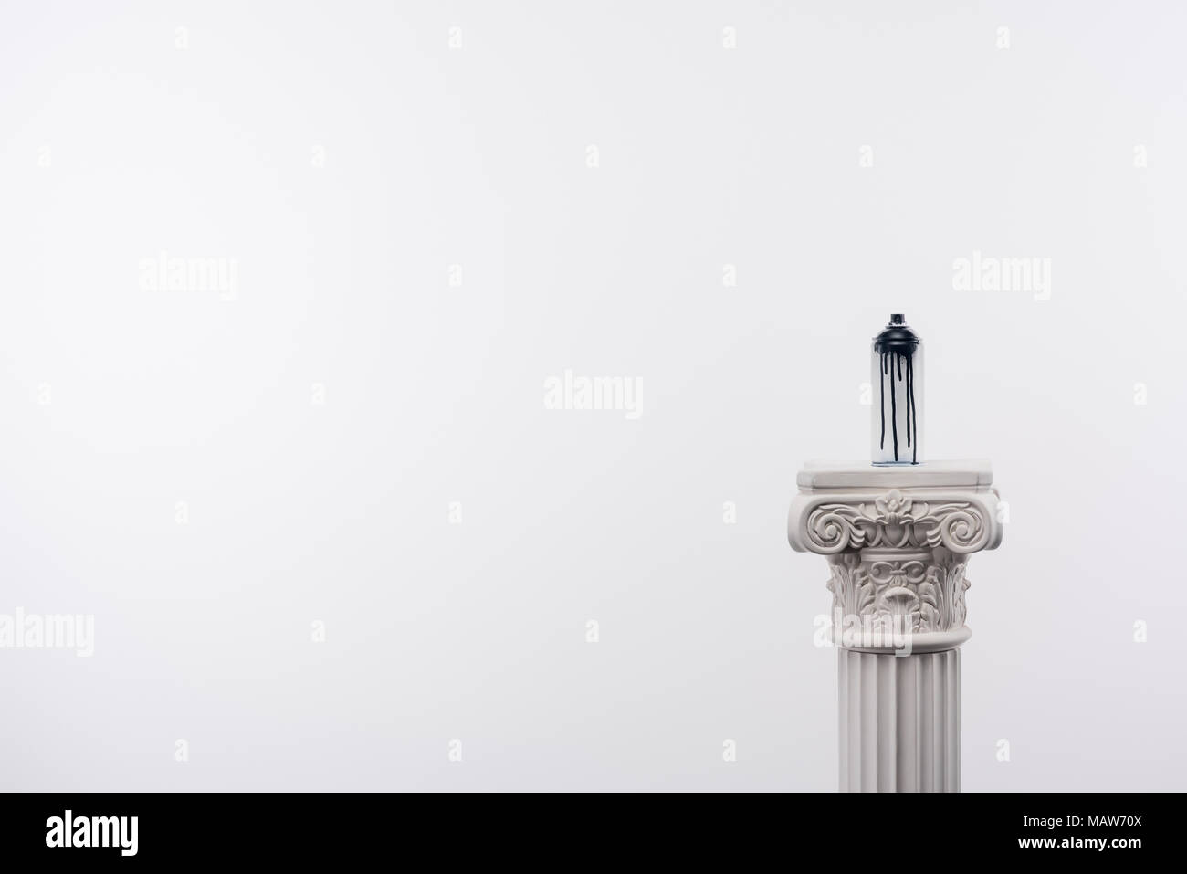 close up view of spray paint in can standing on column isolated on white Stock Photo