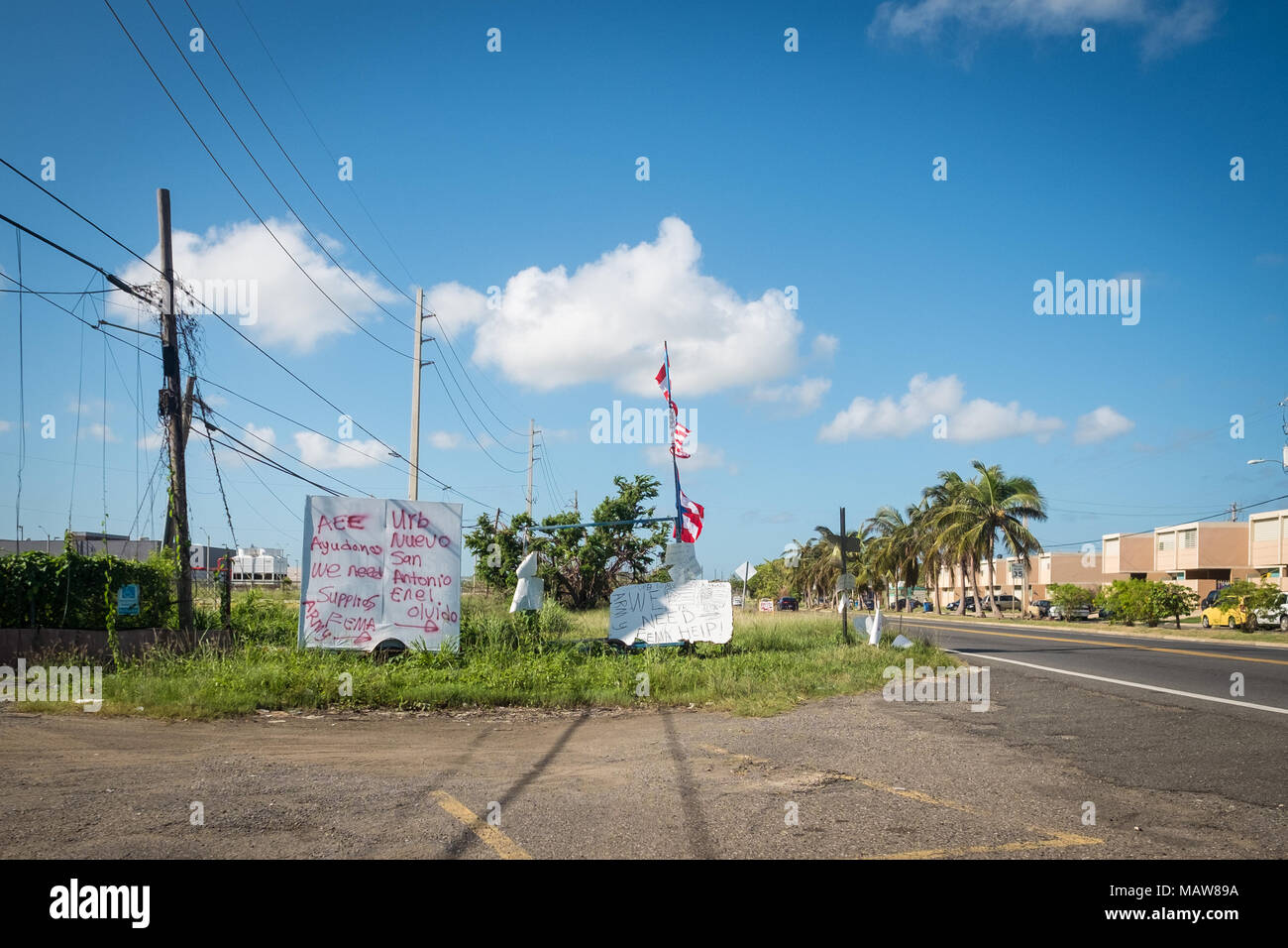 Aguadilla, Puerto Rico. 24th October, 2017. Residents of Aguadilla leave signs out on the main road begging for food and water a month after Hurricane Maria devastated the island, destroying power, transportation and water infrastructure. Credit: Sara Armas/Alamy Reportage Stock Photo