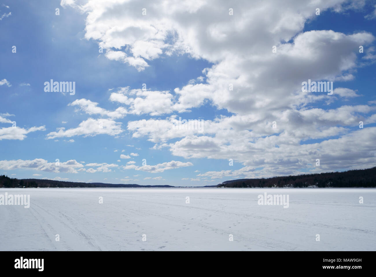 Large blue sky with white clouds on the lake at spring time during a ...
