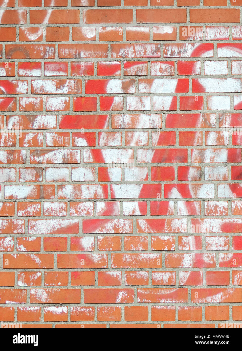 Brick stone wall background, textured stone background. Full frame shot of a red brick wall, backdrop. Stock Photo