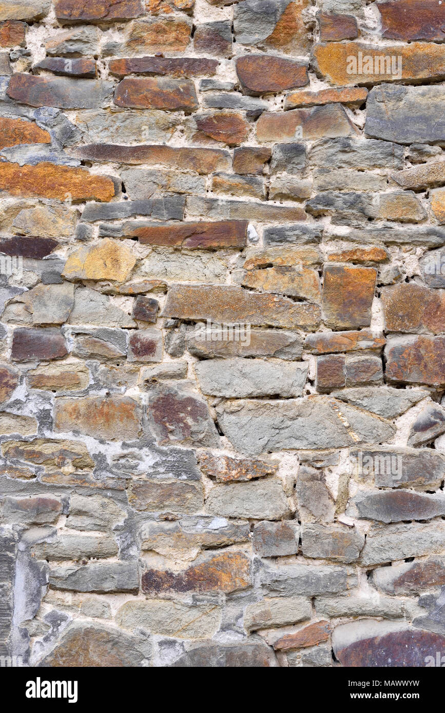 Antique stonewall background with plaster stones or sandstone. Stock Photo