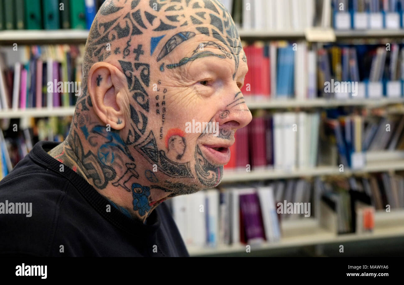 Tattooed man named Gerry in Northern England UK. Gerry was happy  for me to photograph him when I mentioned I liked his Rolling Stones tongue logo Stock Photo