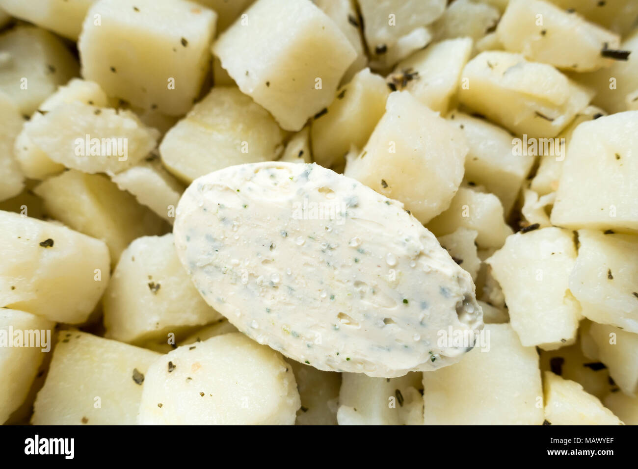 Some parsley butter on parmentier potatoes Stock Photo Alamy