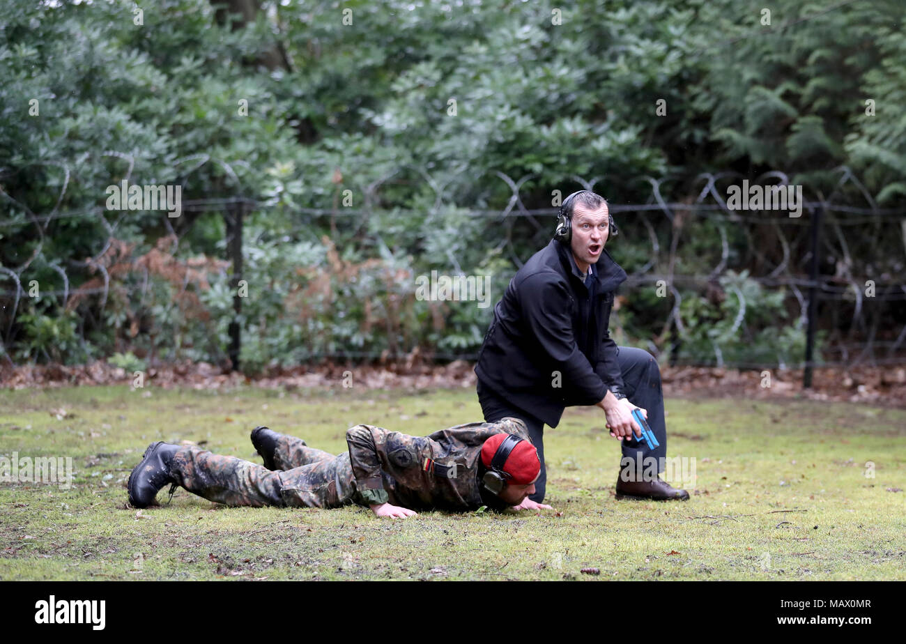 A member of the Close Protection Unit Royal Military Police (right