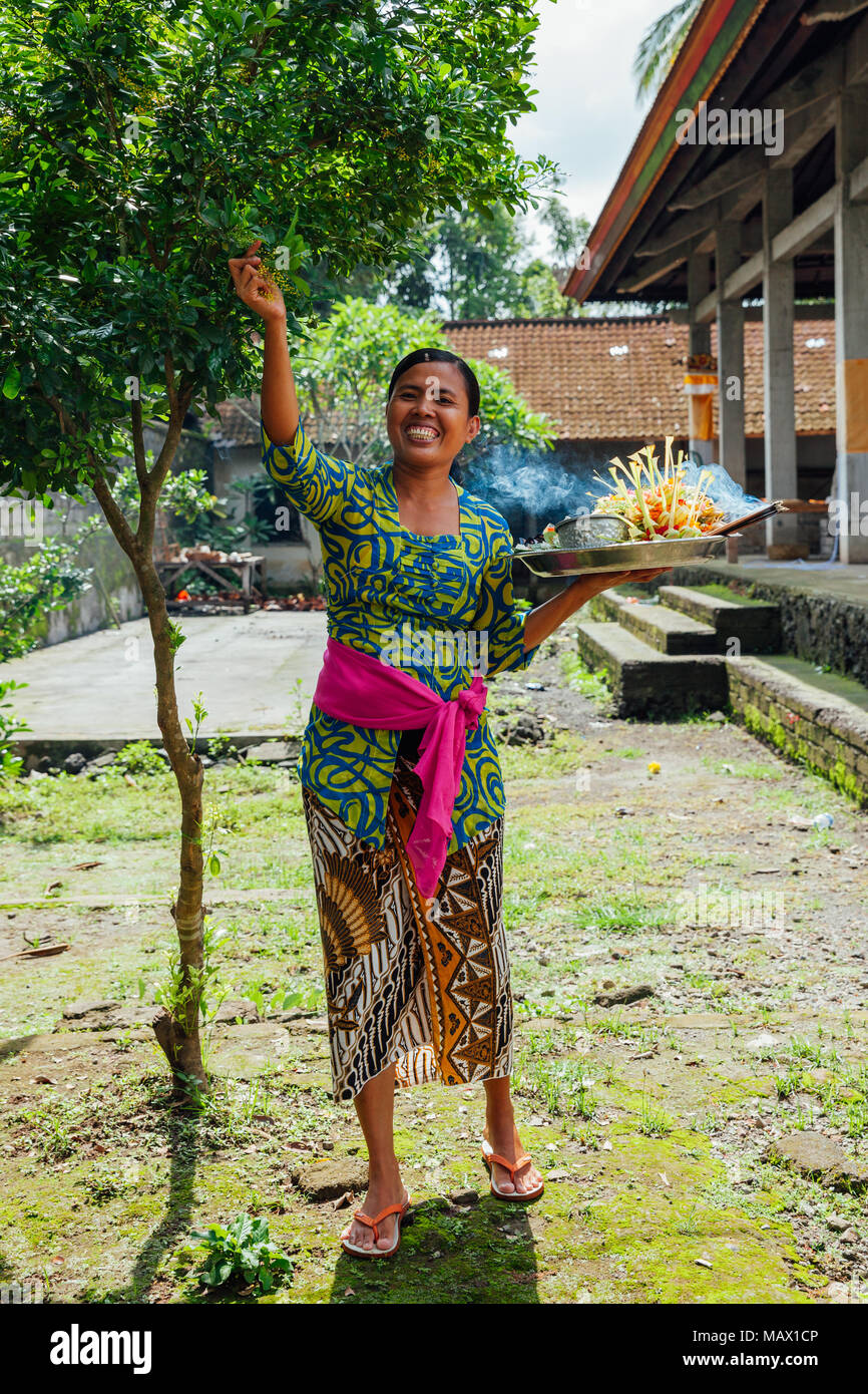 Ubud, Indonesia - March 01, 2016: Balinese woman in traditional clothes