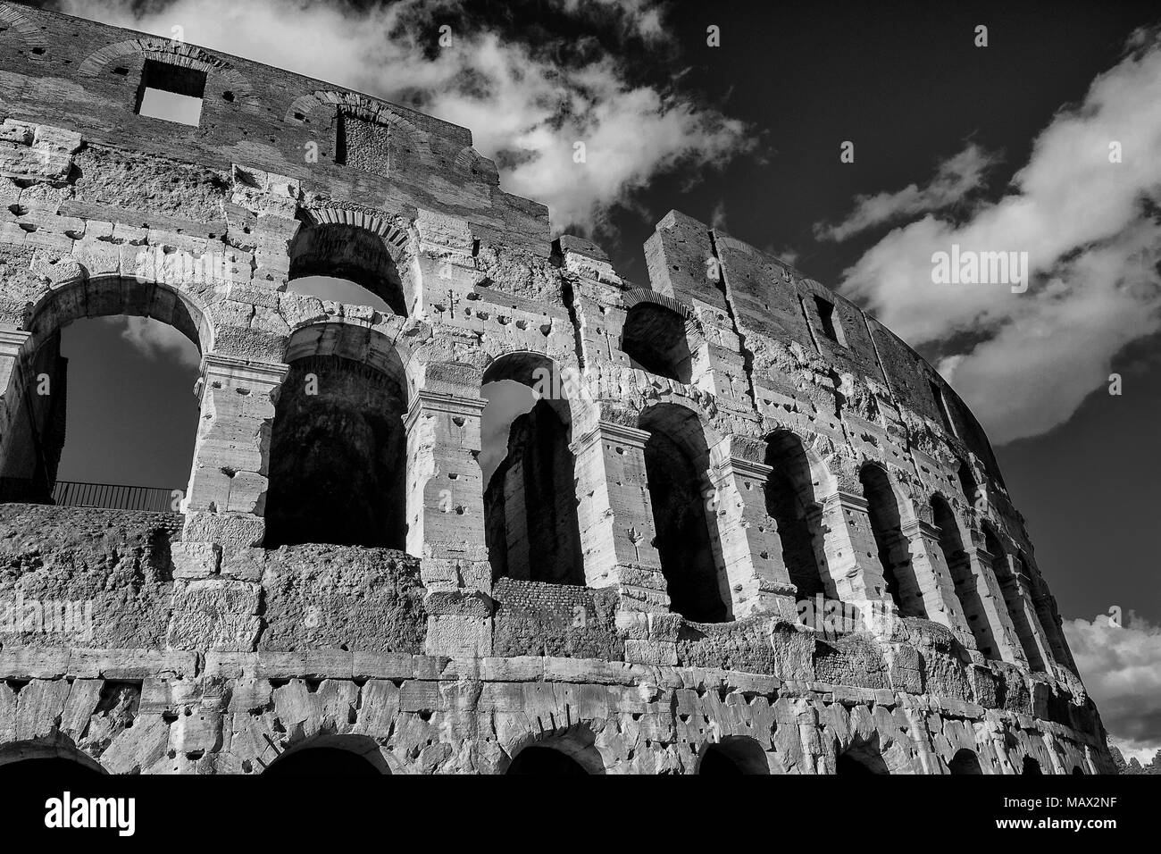 Coliseum inner ring monumental arcades with clouds in Rome (Black and White) Stock Photo
