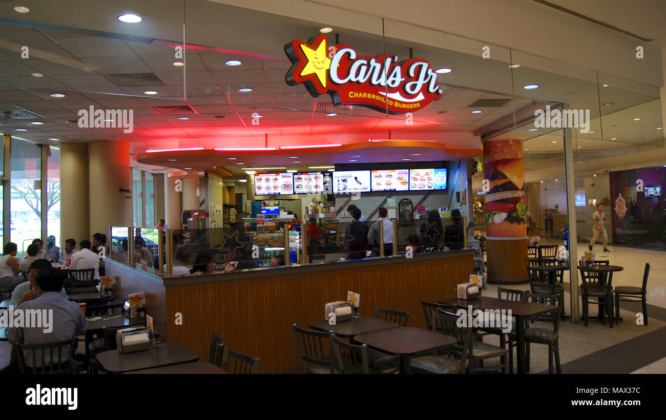 SINGAPORE - APR 2nd 2015: Carl's Jr. is an American-based quick service restaurant chain operating in 44 states and 38 foreign countries and U.S. territories Stock Photo