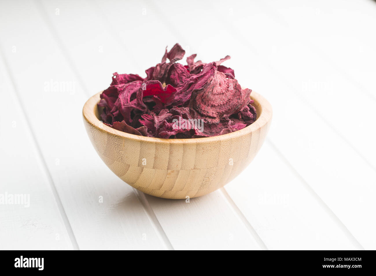 Dried beetroot chips in bowl. Stock Photo