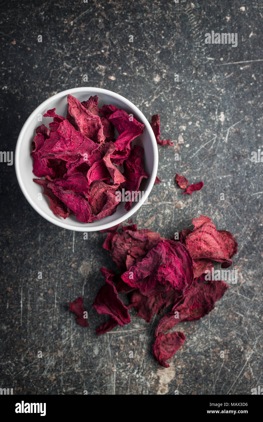 Dried beetroot chips in bowl. Stock Photo