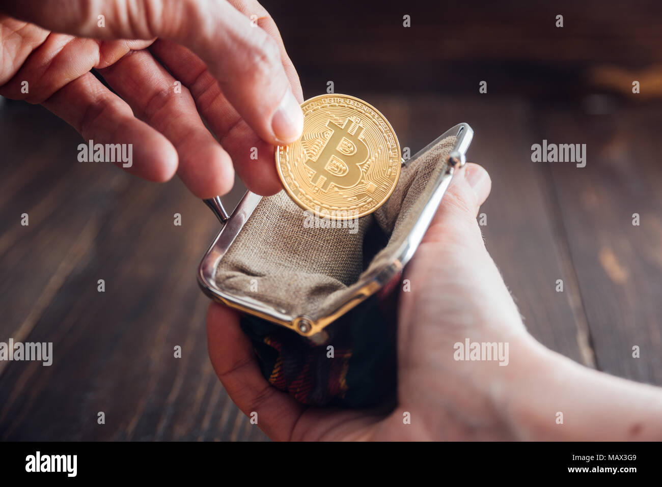 Man Hand Putting Bitcoin Into Wallet Bitcoin Symbol Gold!   en Coin - 