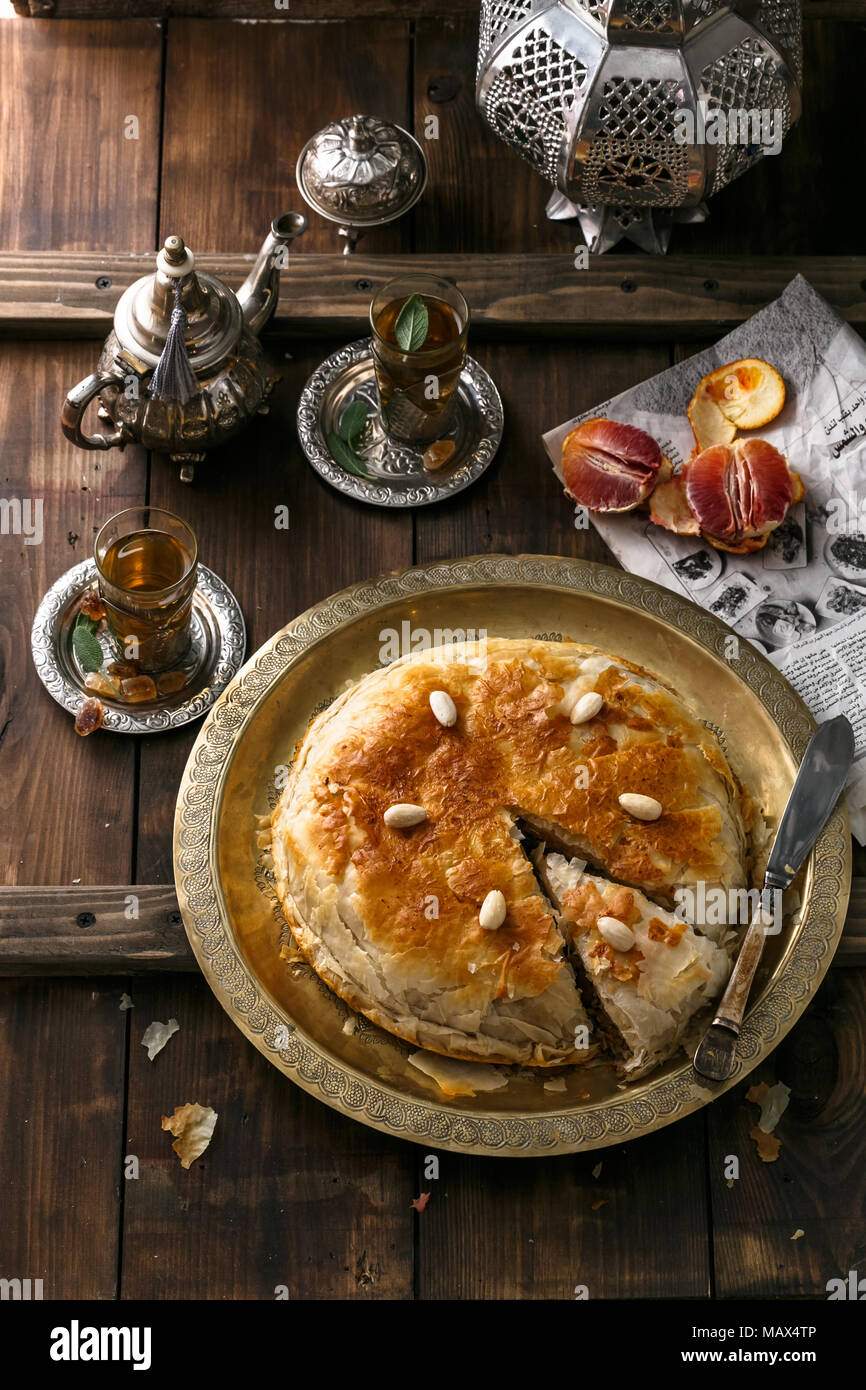 Middle eastern pie with tea, traditional style Stock Photo - Alamy