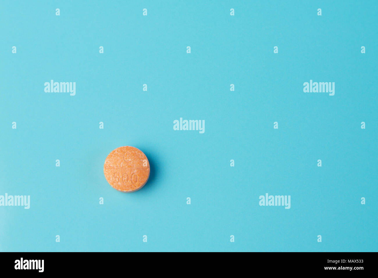 Tablet vitamin c on a blue surface Stock Photo