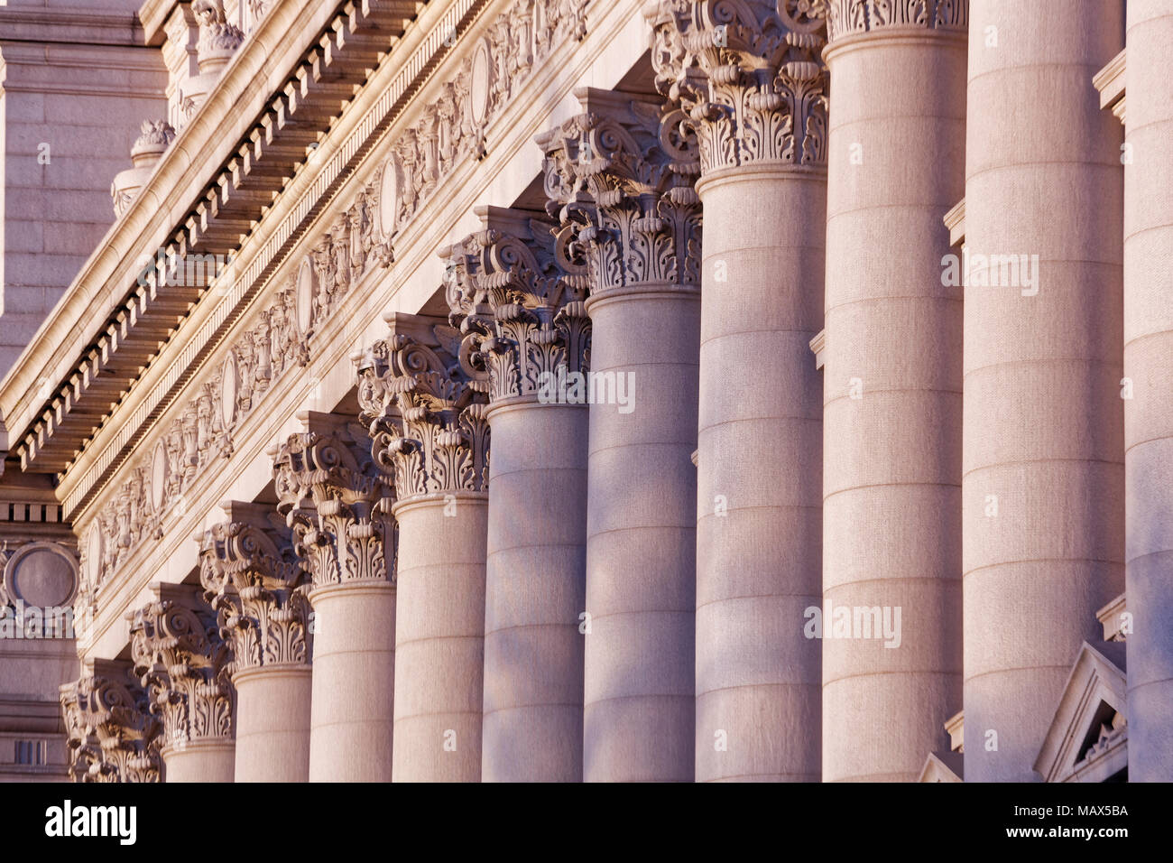 A series of Corinthian Columns shot at sunset, this was taken in lower Manhattan at the old customs house Stock Photo