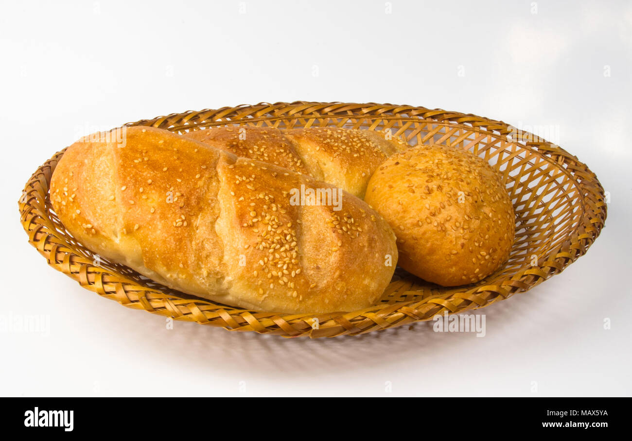 whole wheat breads and bun on a wicker plate Stock Photo - Alamy